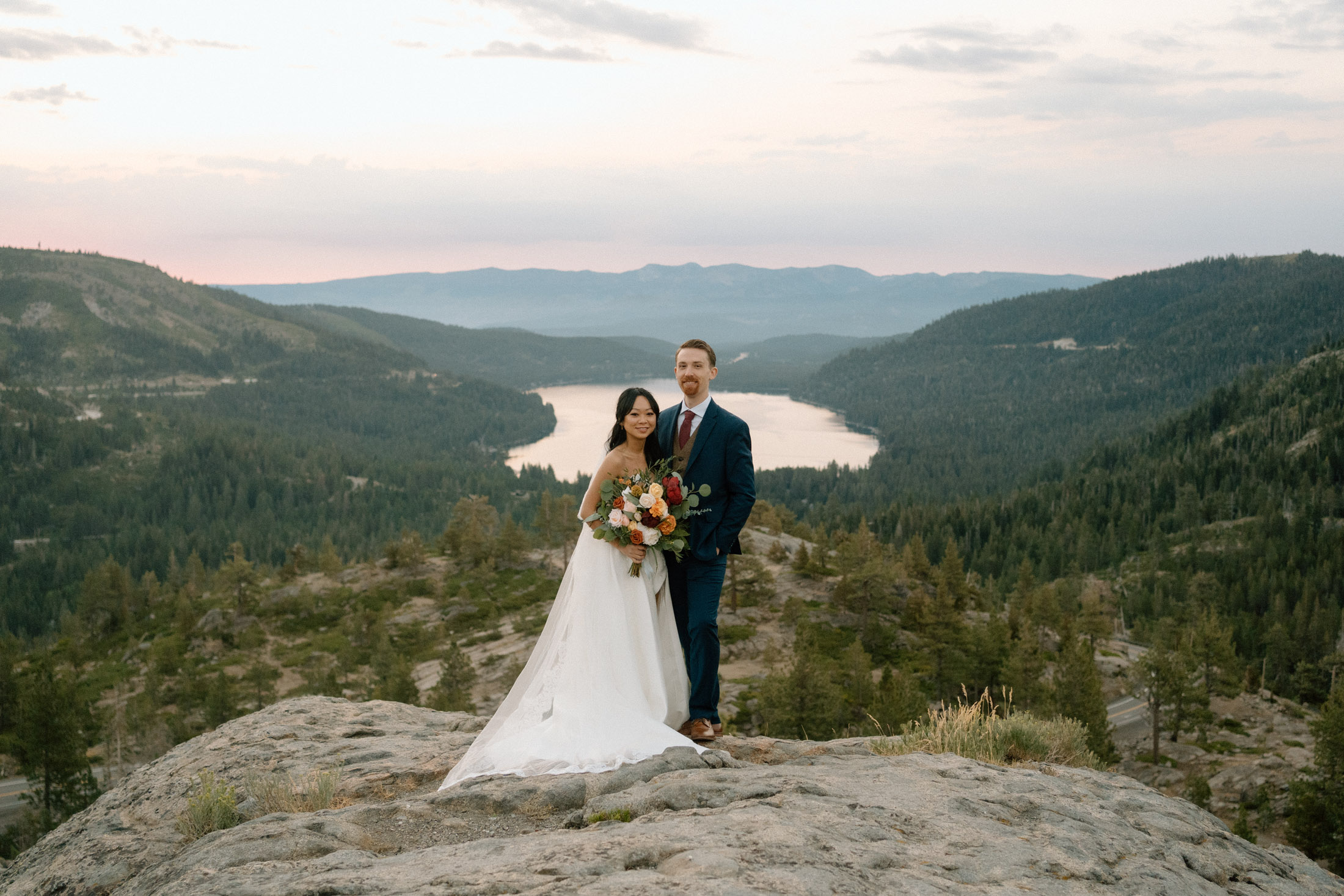 elopement couple standing at Donner Lake Overlook in California