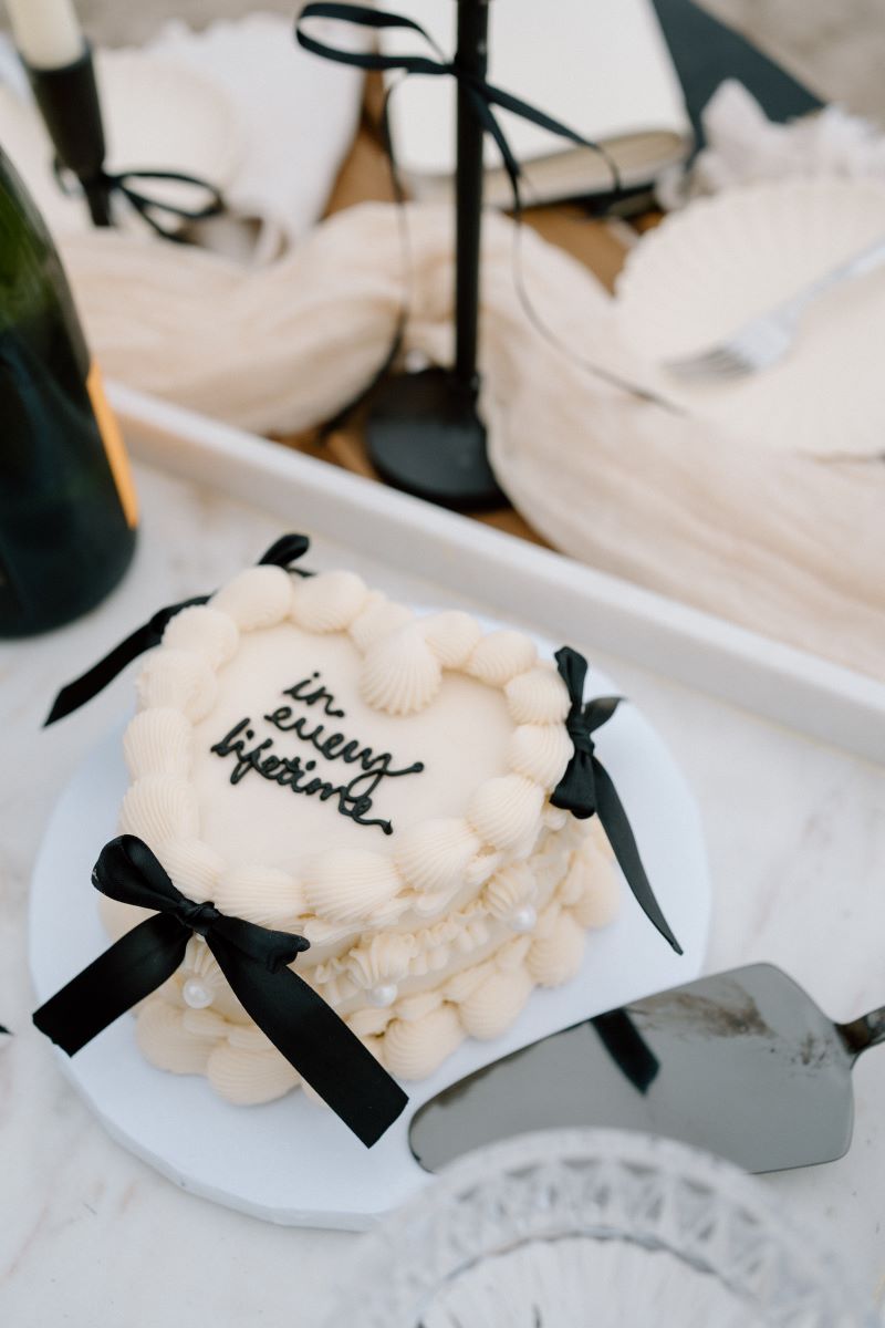 A wedding cake with a cake server