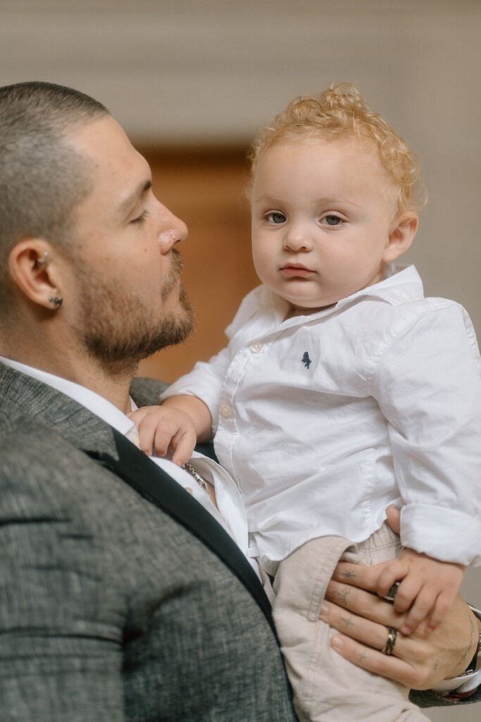 A person holding a small child in their arms 